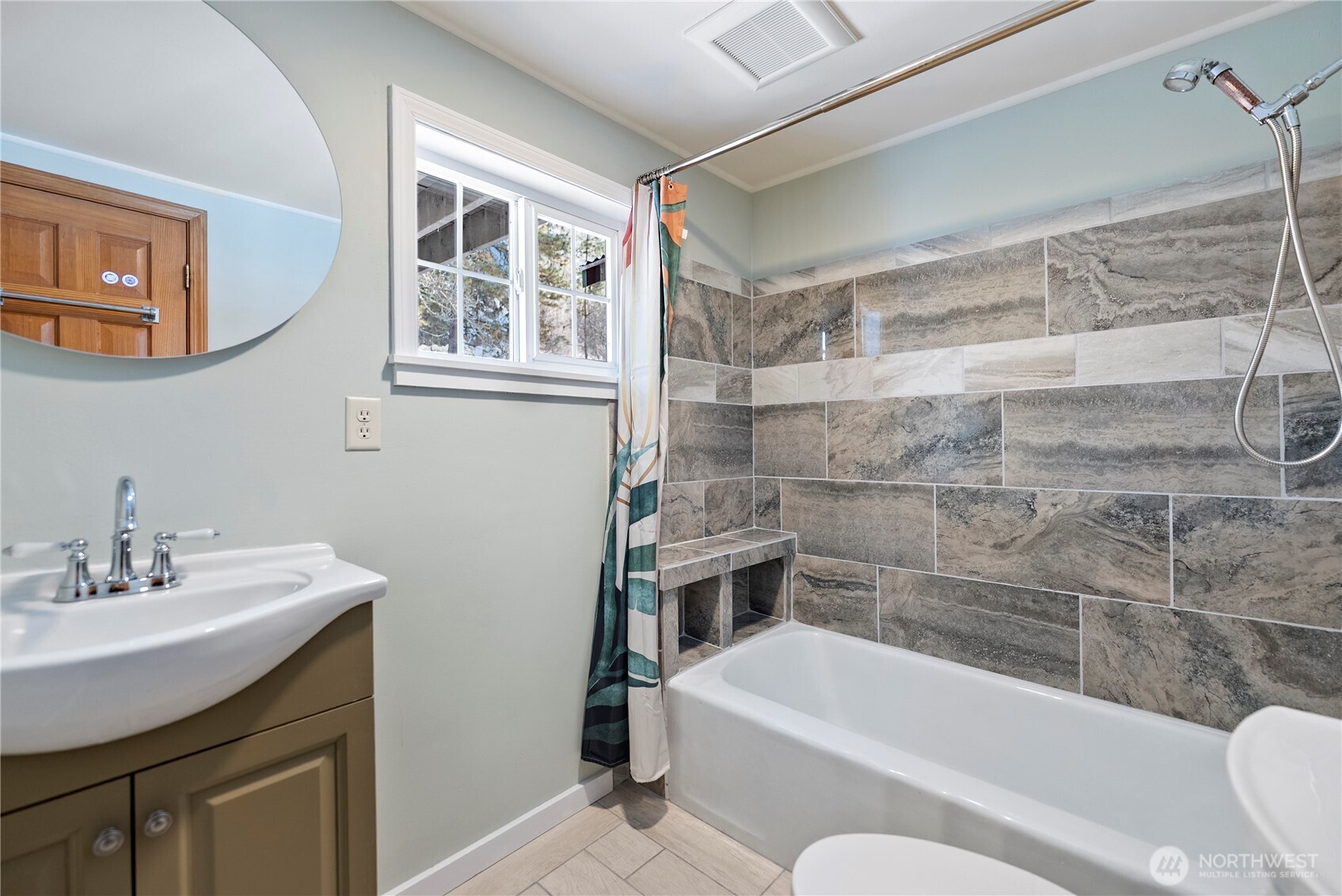 146 East Chewuch Road Winthrop, WA 98862 - Photo 24 of 39 a bathroom with a sink mirror bathtub and toilet