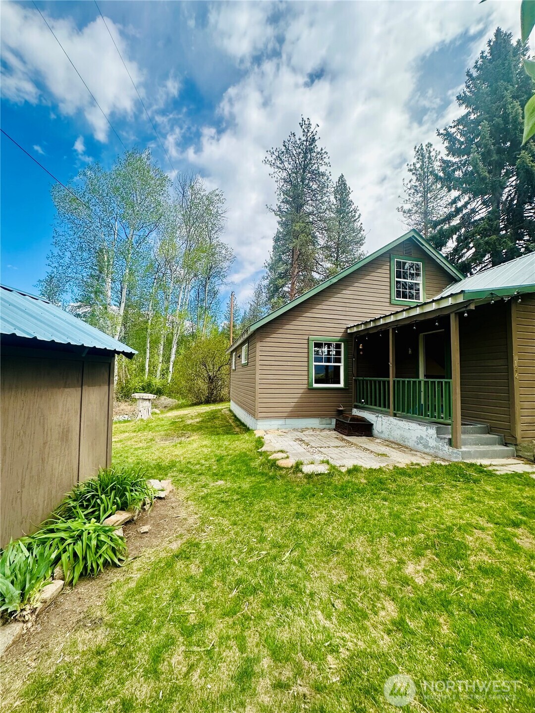 146 East Chewuch Road Winthrop, WA 98862 - Photo 4 of 39 a front view of house with yard and green space