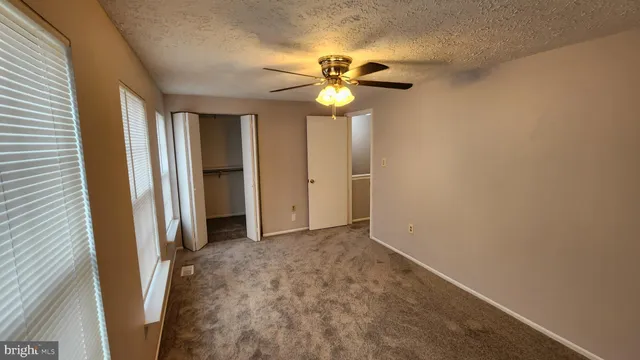 a view of an empty room and a window