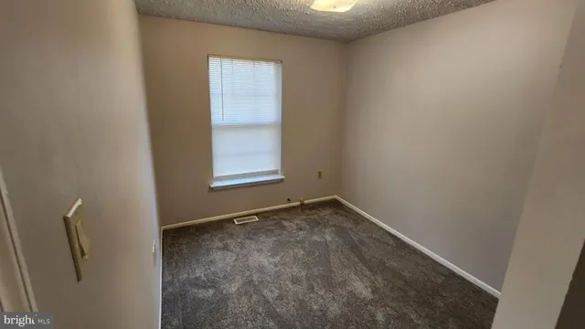 an empty room with closet area