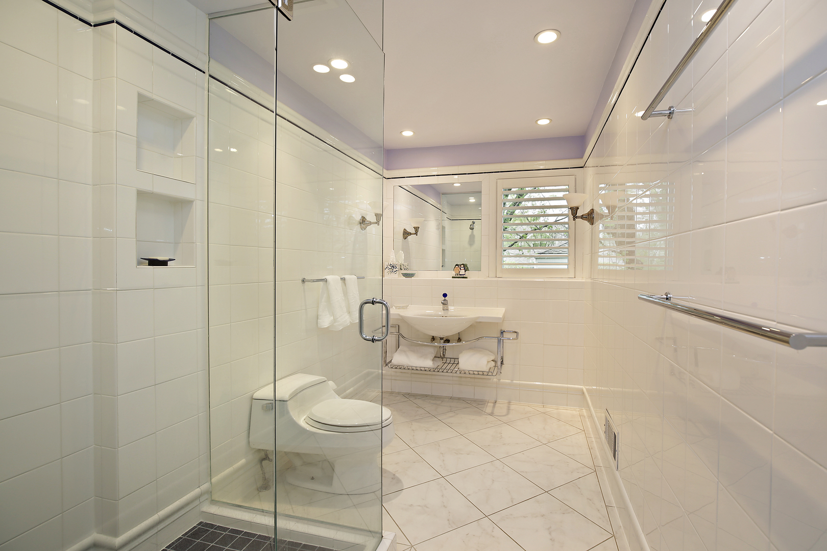 1115 West Deerpath Road Lake Forest, IL 60045 - Photo 12 of 18 a bathroom with a toilet a sink and shower