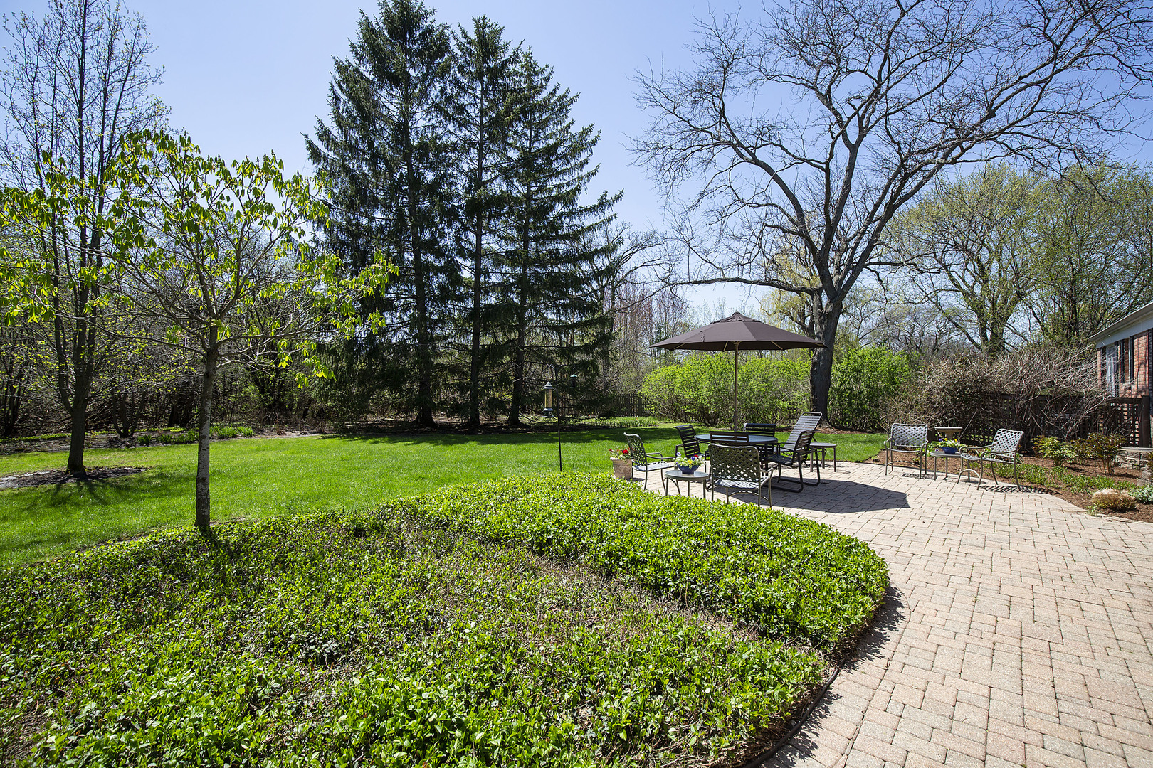 1115 West Deerpath Road Lake Forest, IL 60045 - Photo 15 of 18 a view of a backyard with sitting area