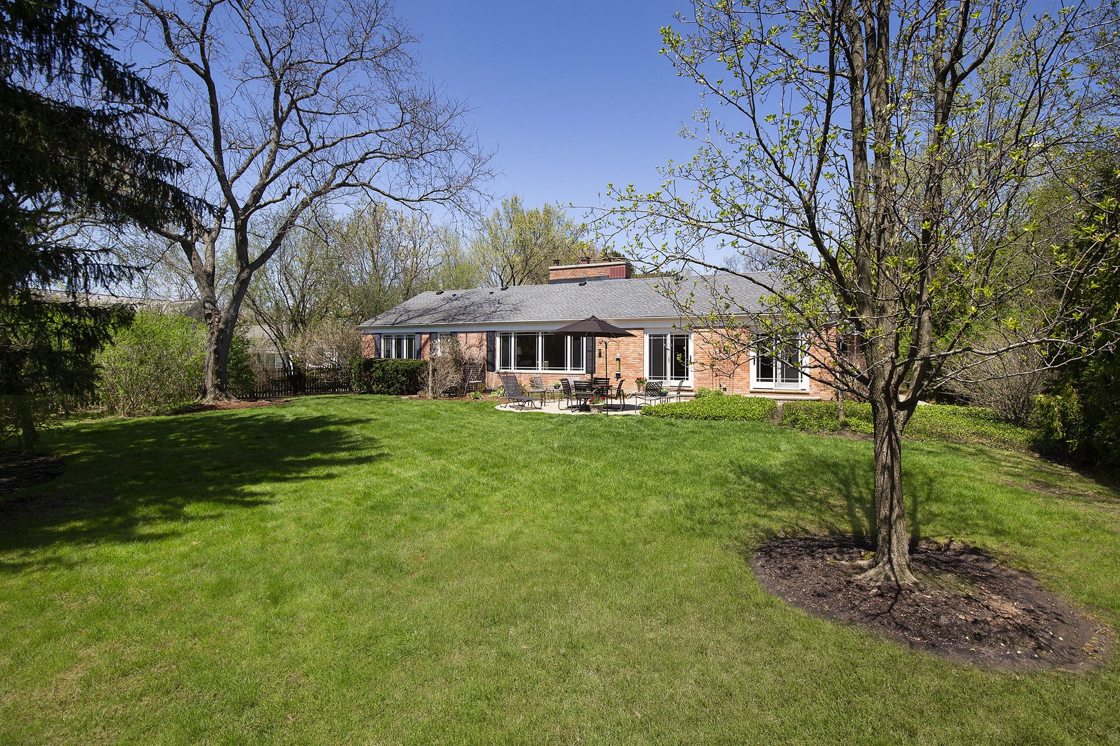 1115 West Deerpath Road Lake Forest, IL 60045 - Photo 16 of 18 a view of a house with a big yard