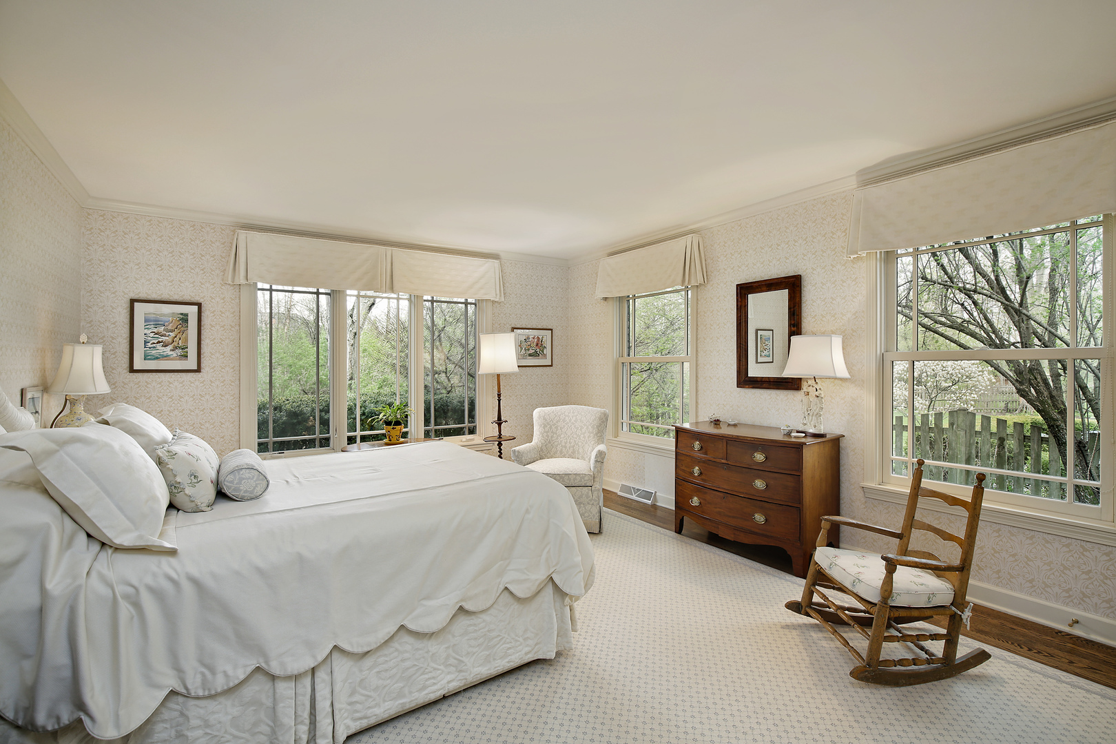 1115 West Deerpath Road Lake Forest, IL 60045 - Photo 9 of 18 a bedroom with a bed a chair and next to a window