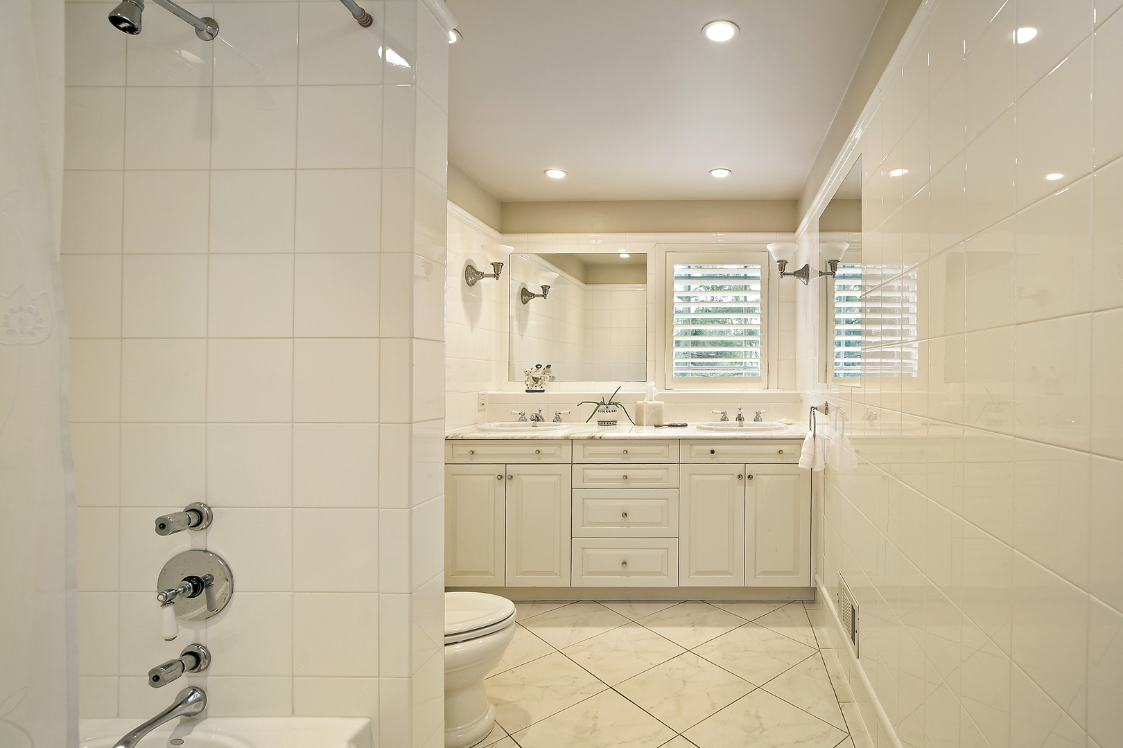 1115 West Deerpath Road Lake Forest, IL 60045 - Photo 10 of 18 a bathroom with a granite countertop sink a toilet and shower