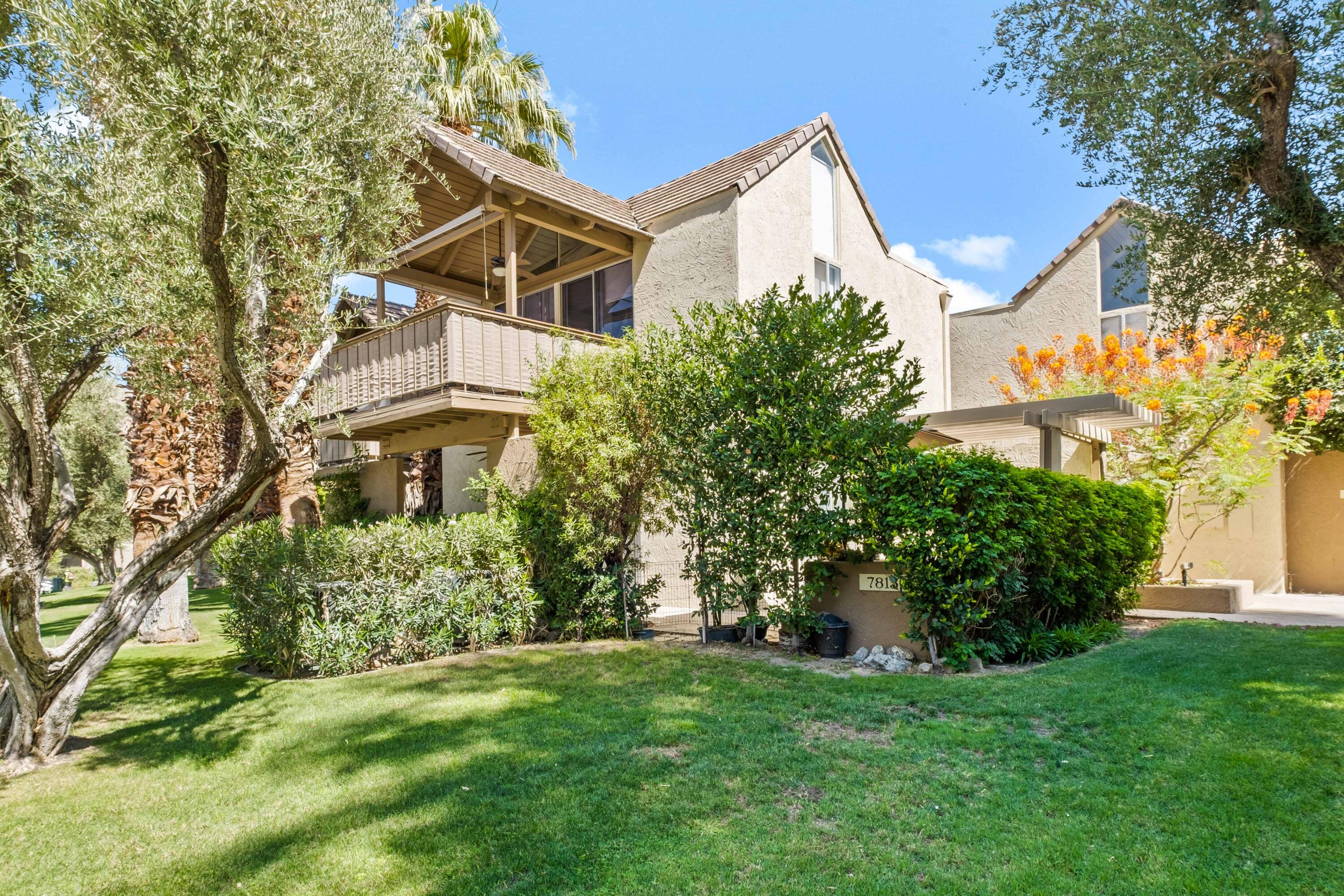 78130 Cortez Lane, Unit 56 Indian Wells, CA 92210 - Photo 14 of 31 a view of a house with a yard