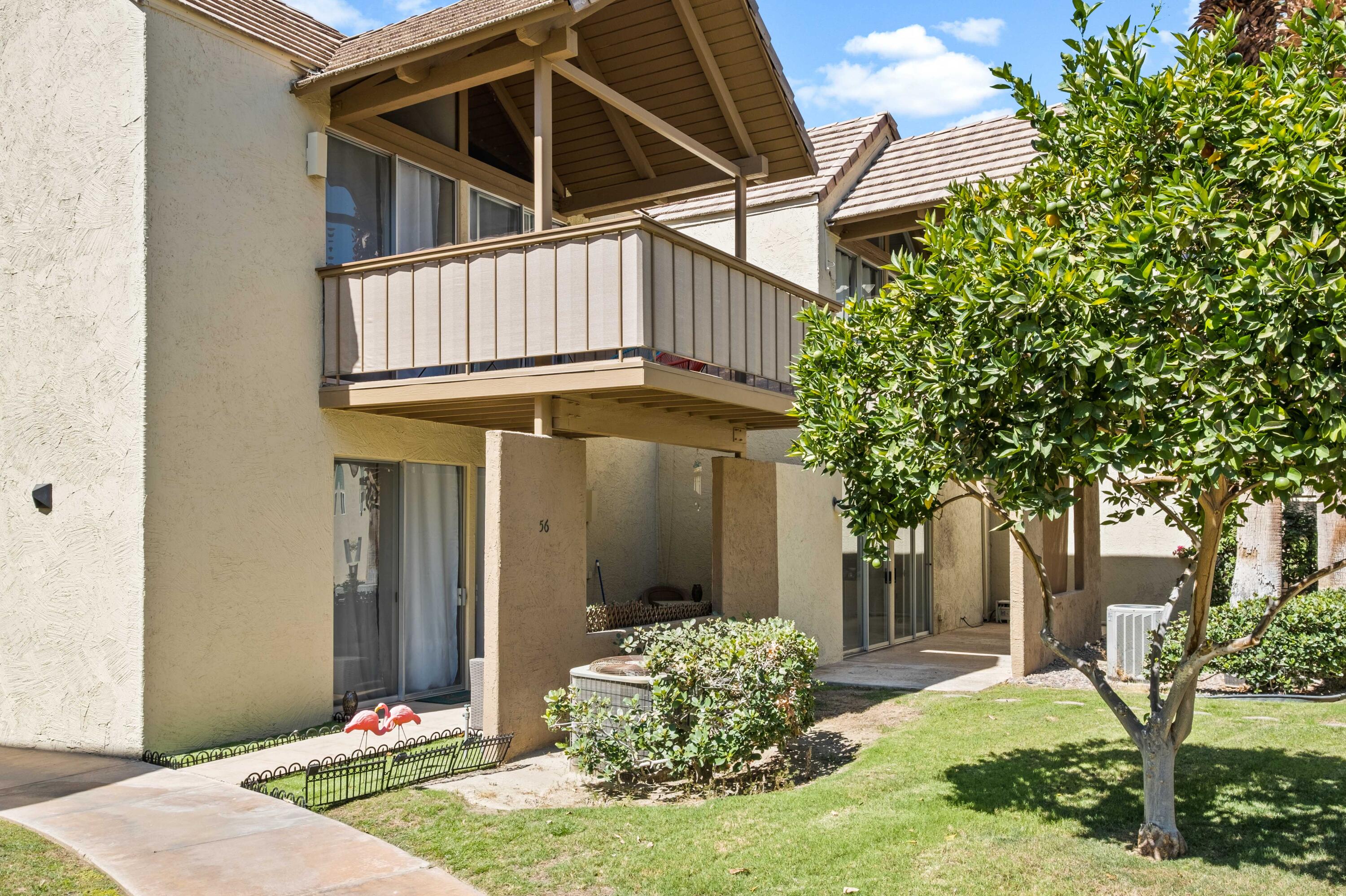 78130 Cortez Lane, Unit 56 Indian Wells, CA 92210 - Photo 15 of 31 a front view of a house with garden
