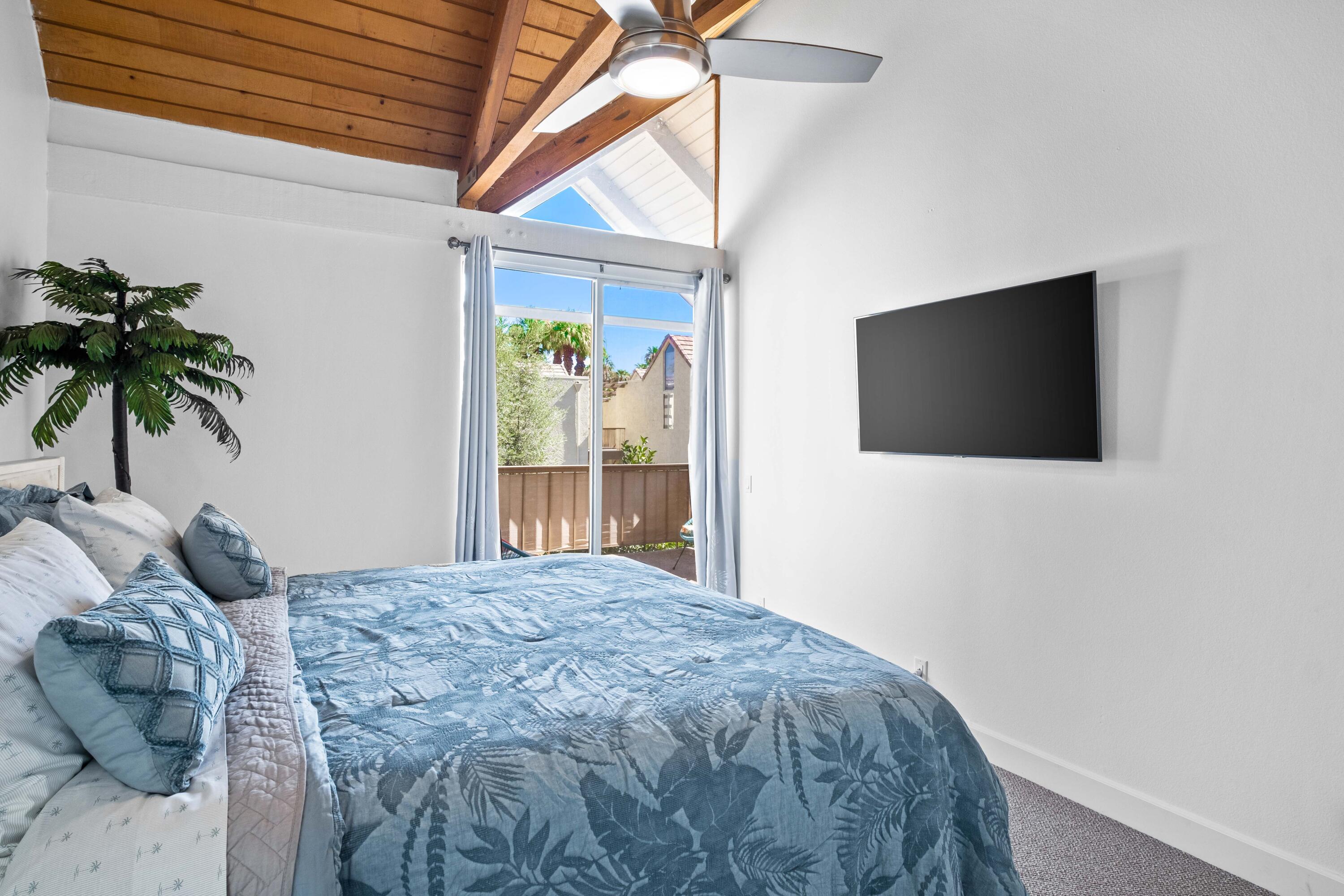 78130 Cortez Lane, Unit 56 Indian Wells, CA 92210 - Photo 23 of 31 a bedroom with a bed and a flat screen tv