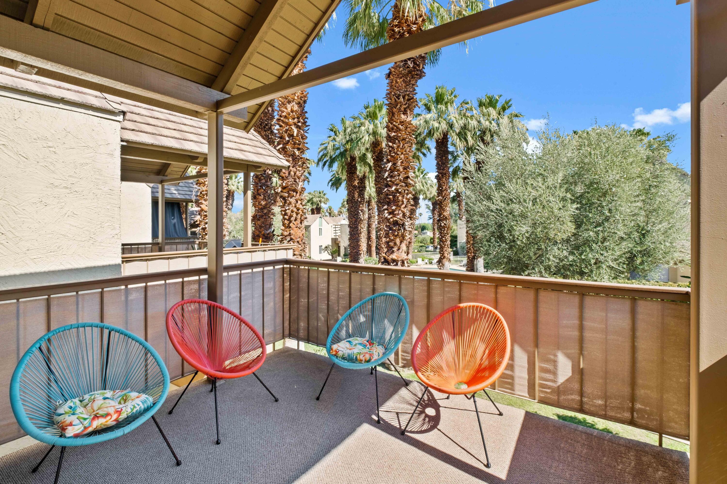 78130 Cortez Lane, Unit 56 Indian Wells, CA 92210 - Photo 25 of 31 a balcony with table and chairs and a potted plant
