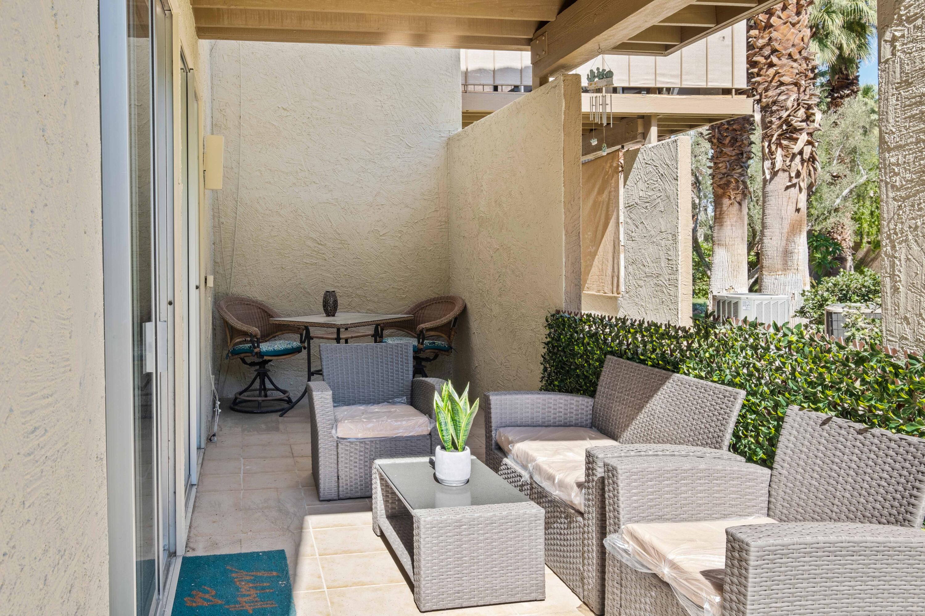 78130 Cortez Lane, Unit 56 Indian Wells, CA 92210 - Photo 26 of 31 a view of a patio with a table and chairs
