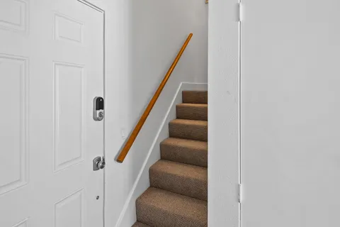 a bathroom with a double vanity sink toilet and a shower