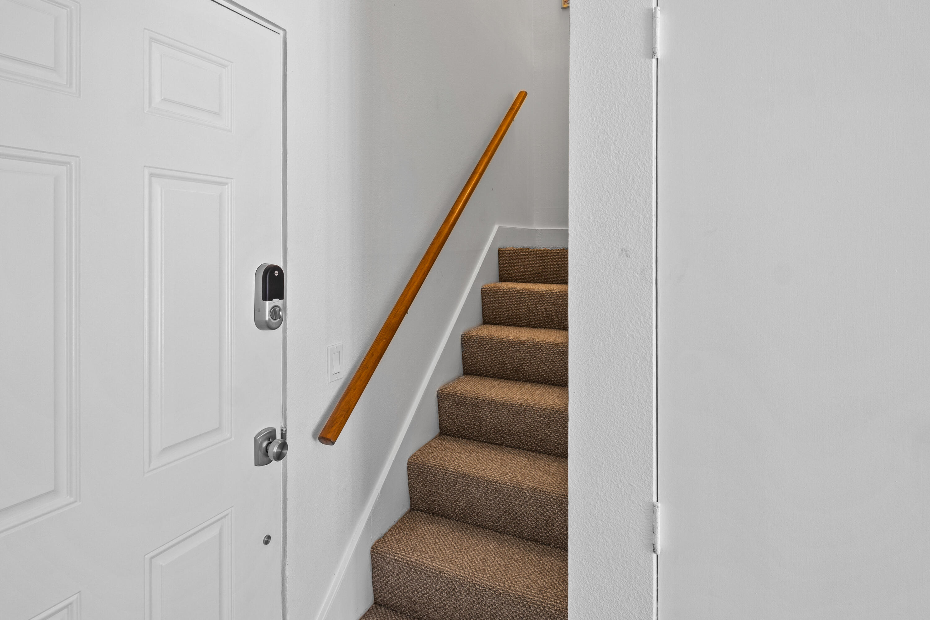 78130 Cortez Lane, Unit 56 Indian Wells, CA 92210 - Photo 29 of 31 a view of staircase with lots of frames on wall and stairs