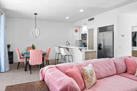 a bed room with two bed and chair