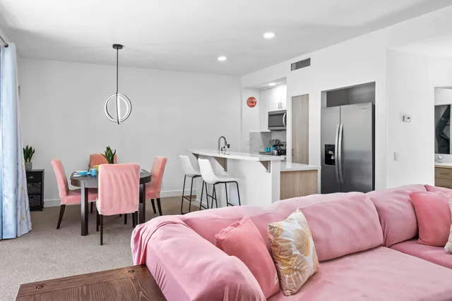 a bed room with two bed and chair