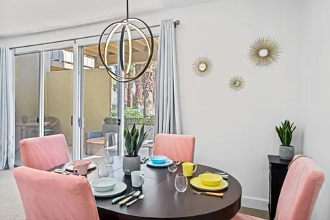 a view of a dining room with furniture window and outside view