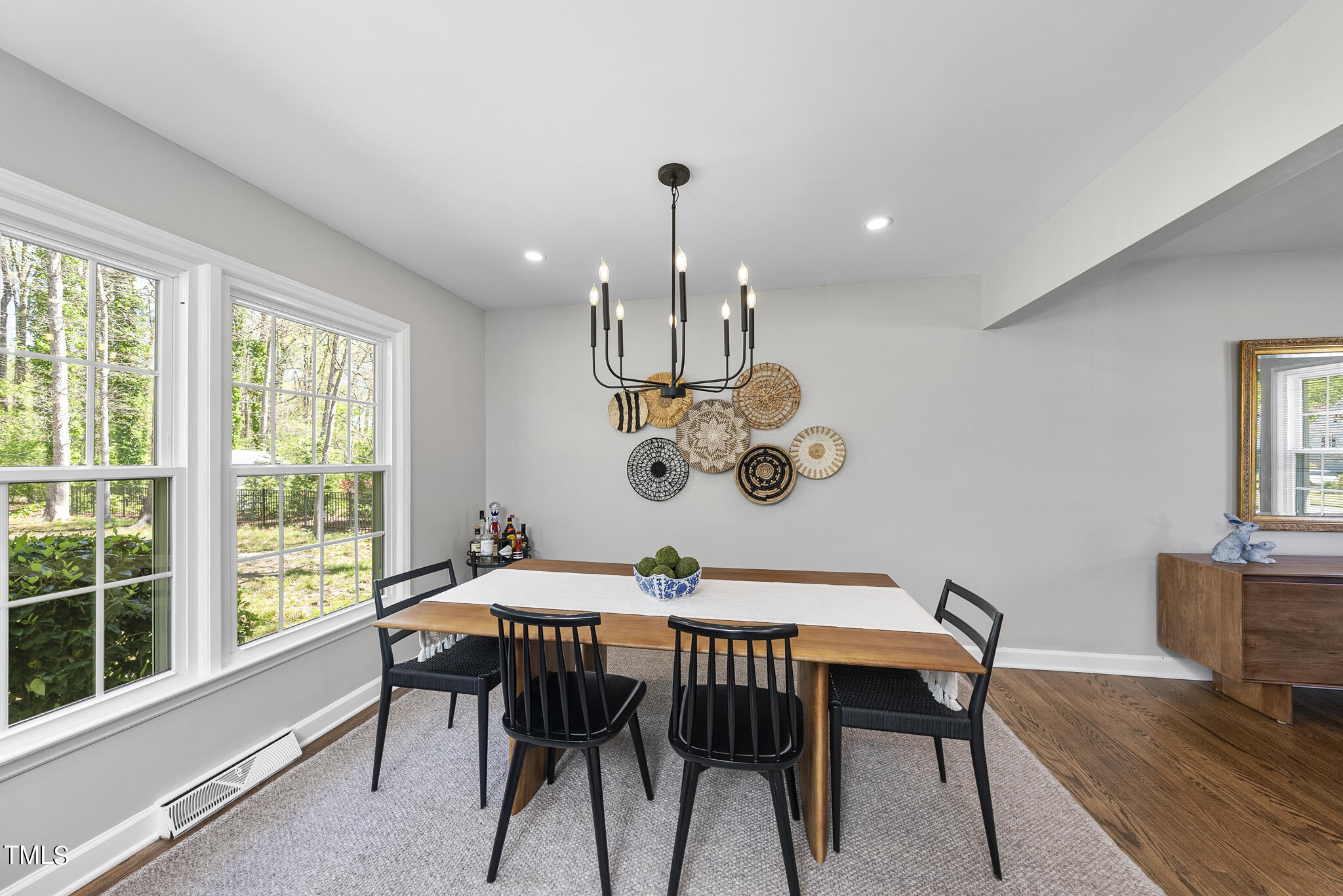 509 Dartmouth Road Raleigh, NC 27609 - Photo 7 of 34 a dining room with furniture a window and wooden floor