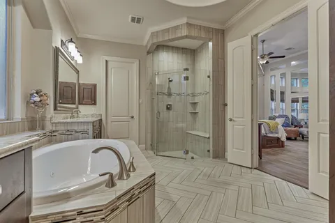 a spacious bathroom with a sink shower and a mirror