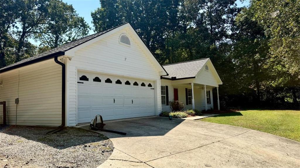 6258 Southern Magnolia Lane Lula, GA 30554 - Photo 15 of 17 a front view of a house with a yard
