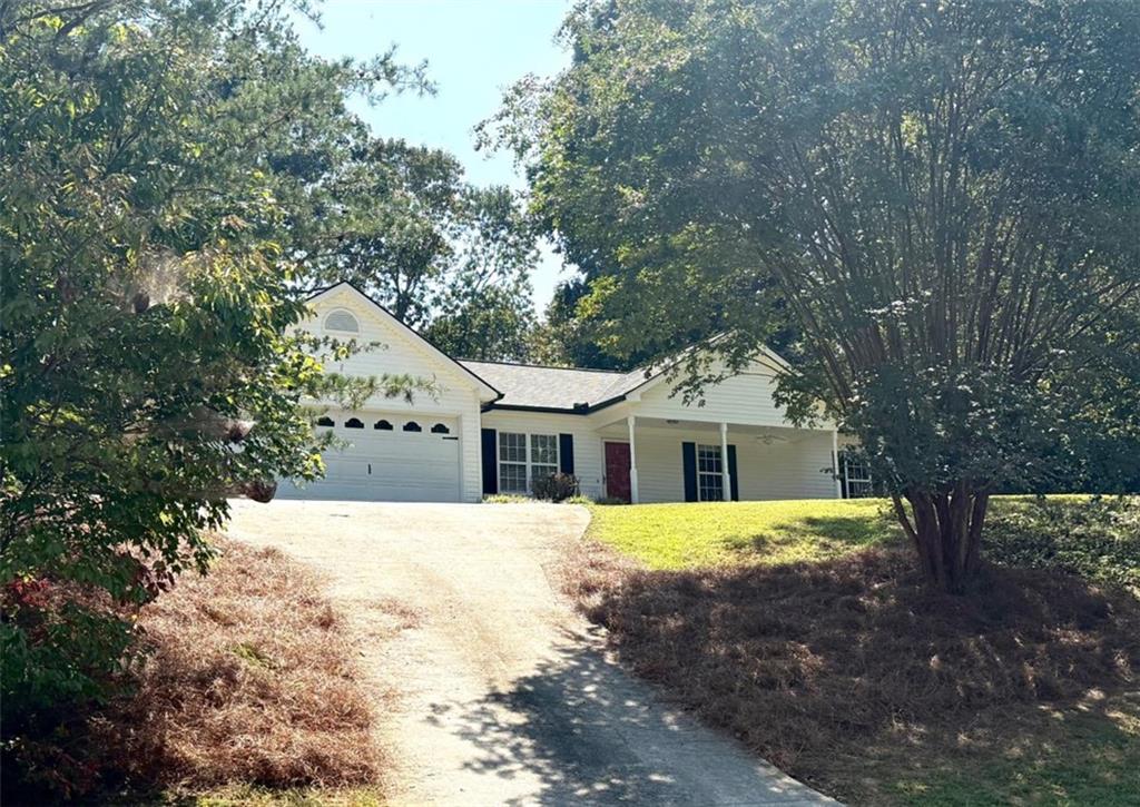 6258 Southern Magnolia Lane Lula, GA 30554 - Photo 17 of 17 a front view of a house with a yard and trees