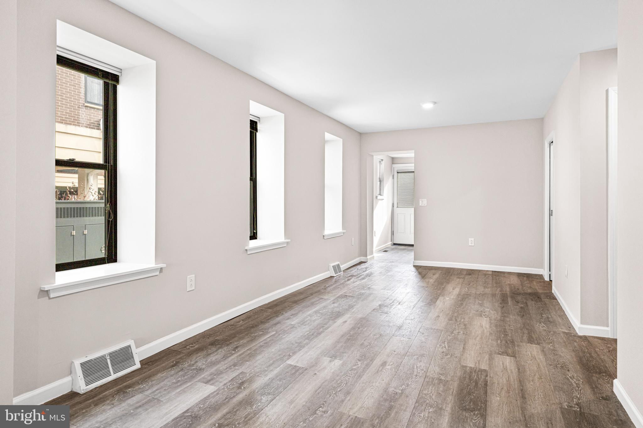 606 Summit Avenue Jenkintown, PA 19046 - Photo 11 of 27 a view of an empty room with wooden floor and a window