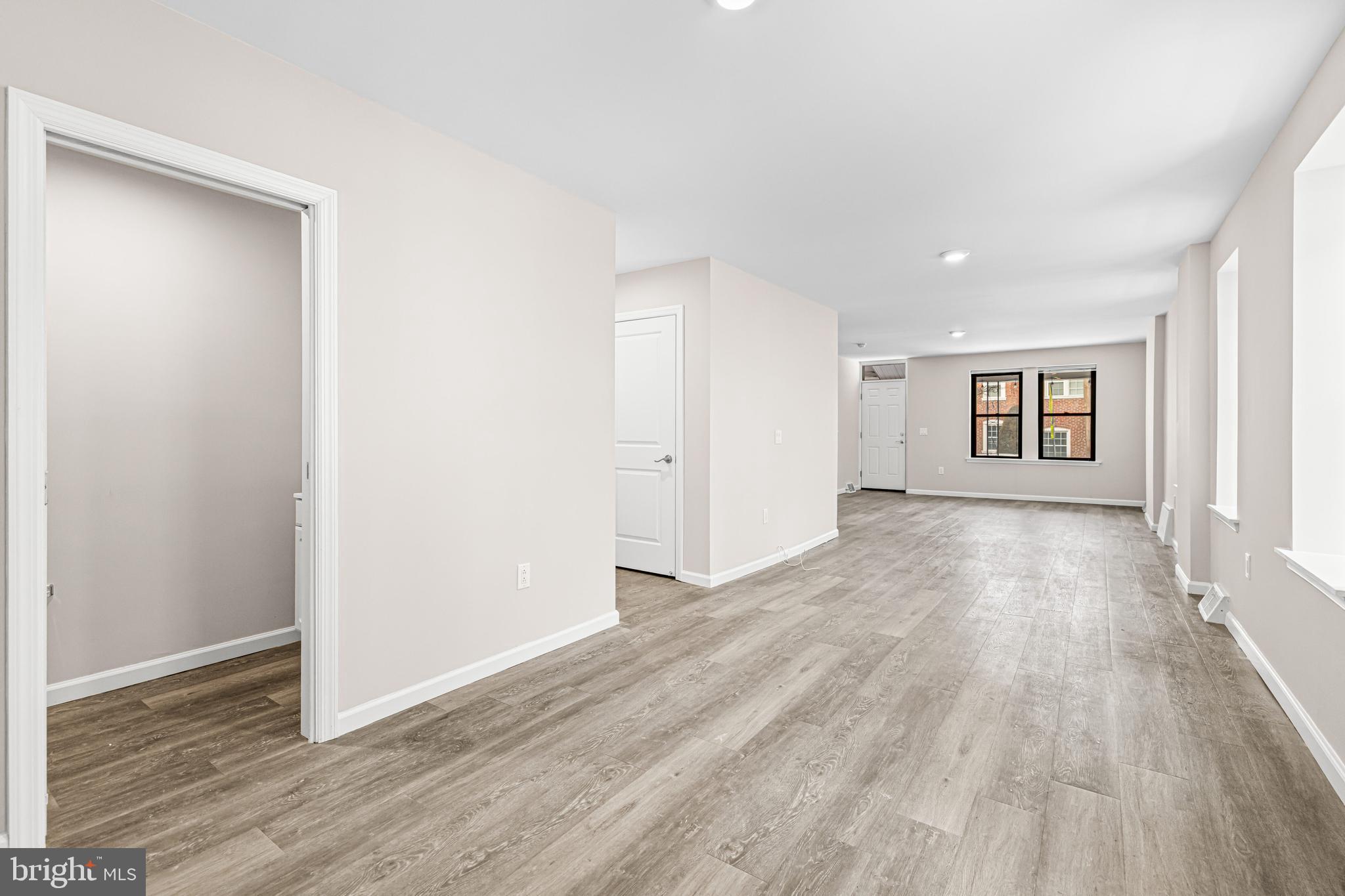 606 Summit Avenue Jenkintown, PA 19046 - Photo 13 of 27 an empty room with wooden floor and windows
