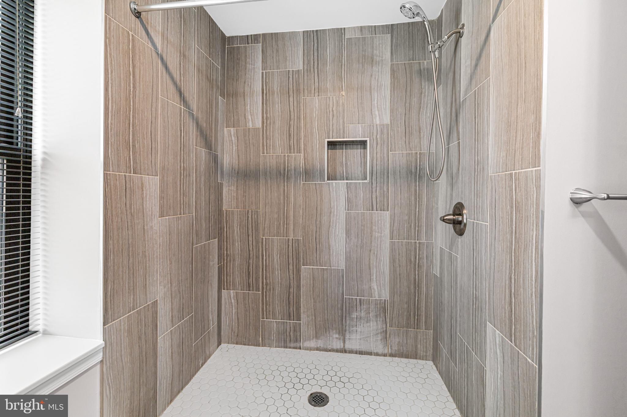 606 Summit Avenue Jenkintown, PA 19046 - Photo 16 of 27 a bathroom with a shower and a tub