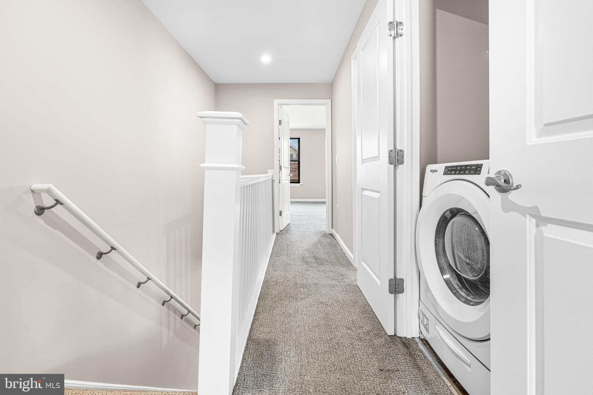 606 Summit Avenue Jenkintown, PA 19046 - Photo 19 of 27 a view of a hallway with washer and dryer