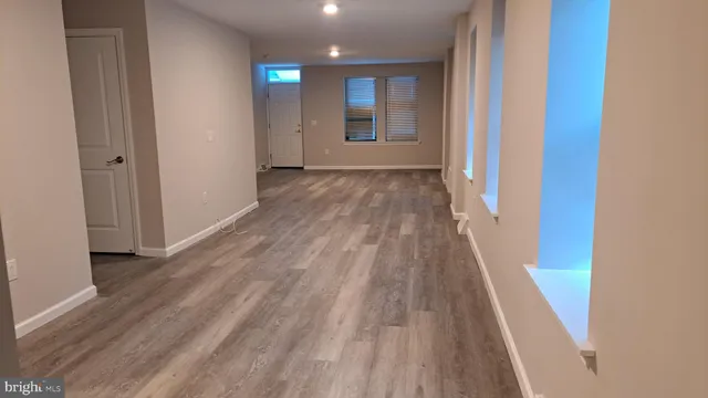 a view of a street with stores