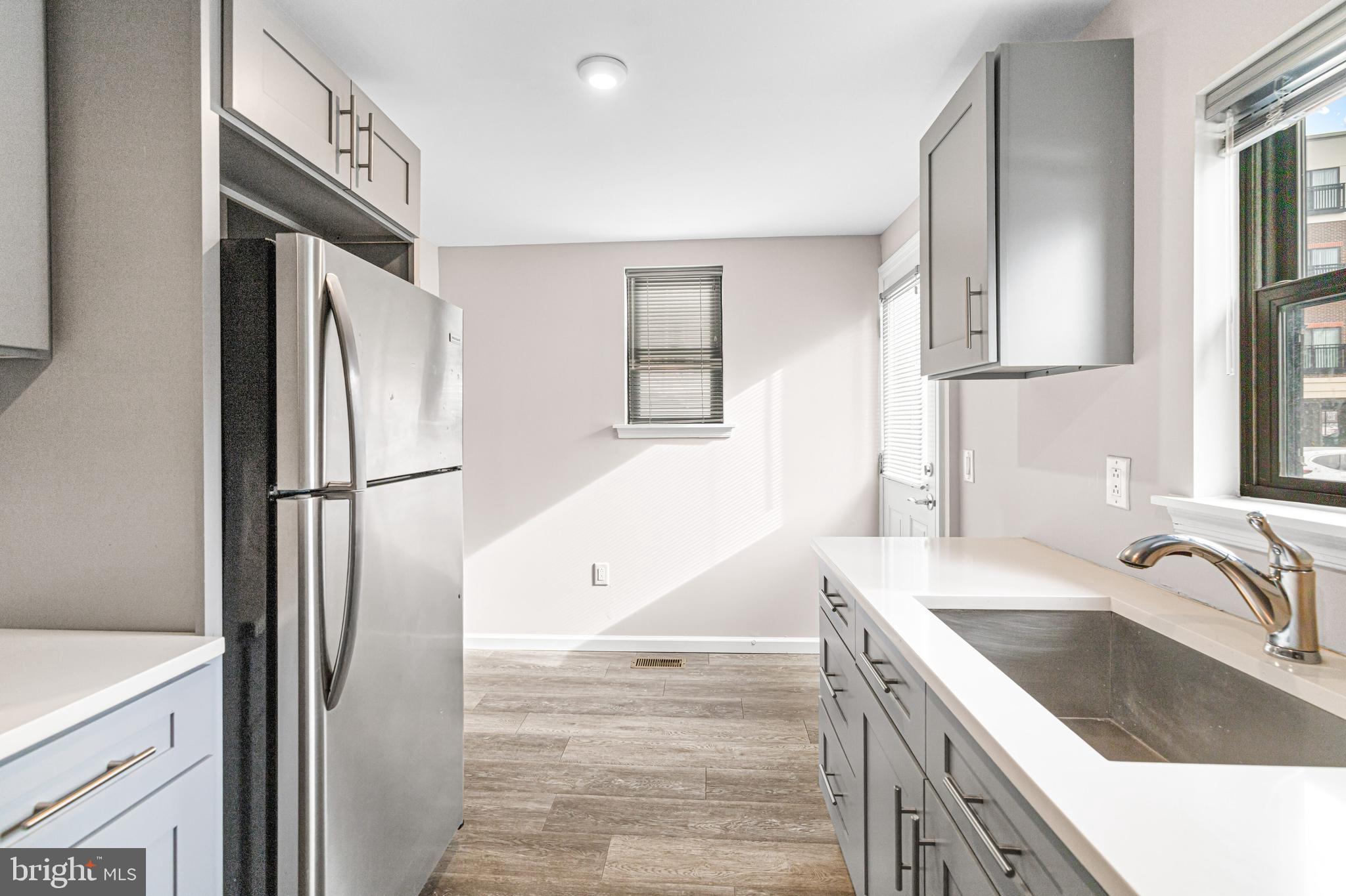 606 Summit Avenue Jenkintown, PA 19046 - Photo 5 of 27 a kitchen with stainless steel appliances granite countertop a refrigerator and a sink