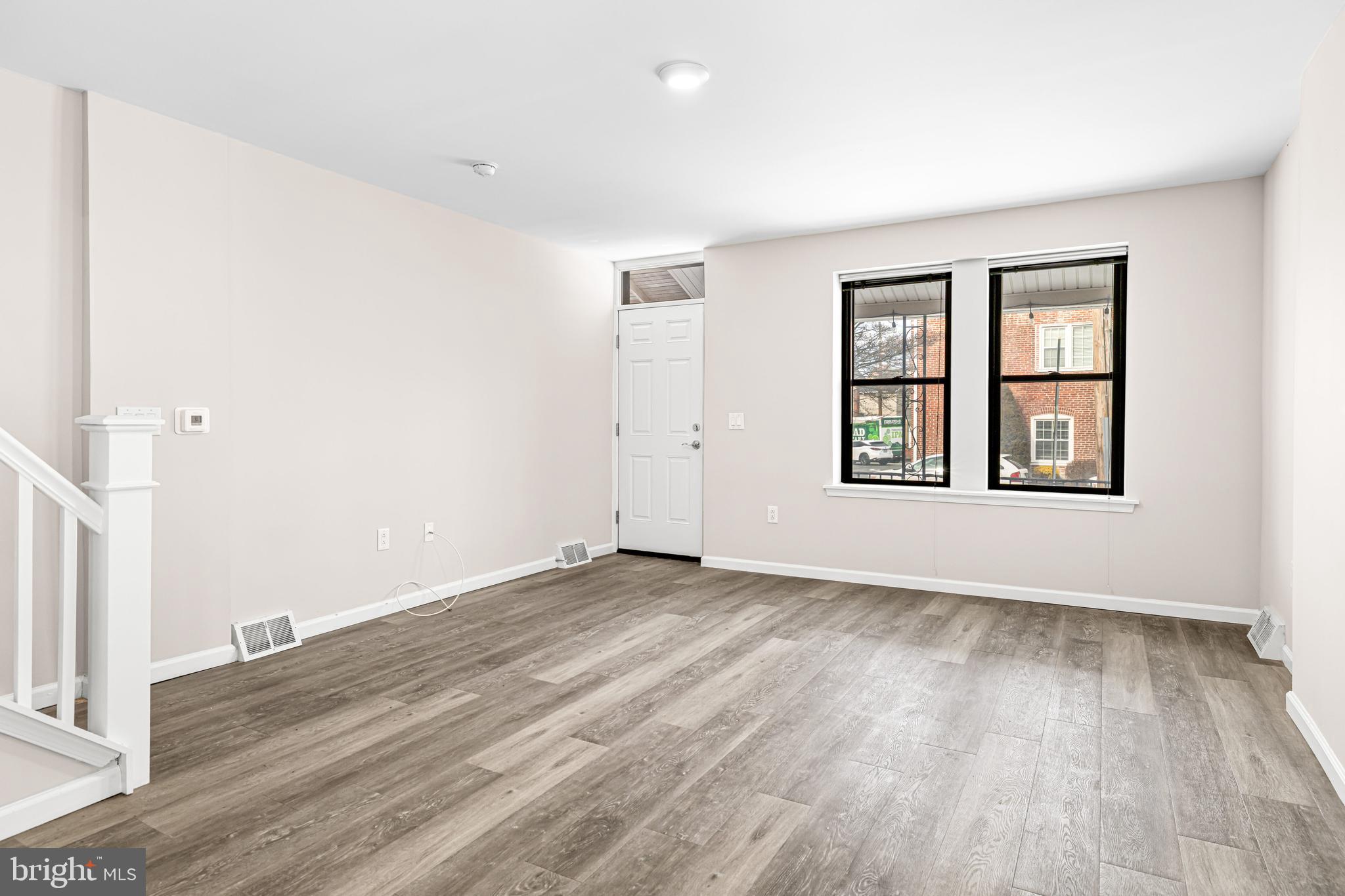 606 Summit Avenue Jenkintown, PA 19046 - Photo 8 of 27 an empty room with wooden floor and windows