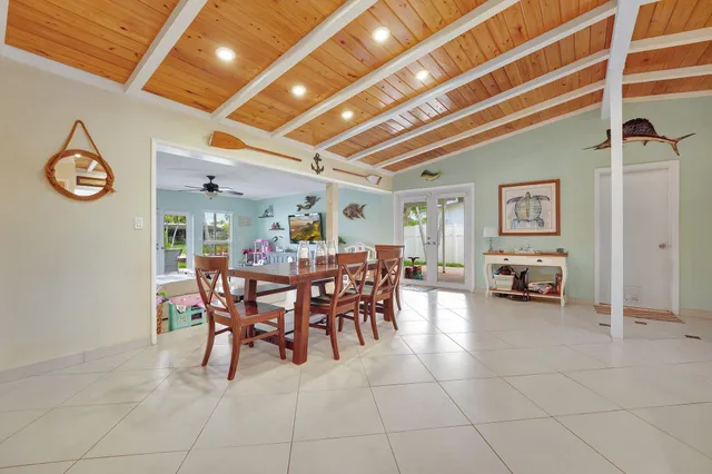 a dining room with furniture and a chandelier
