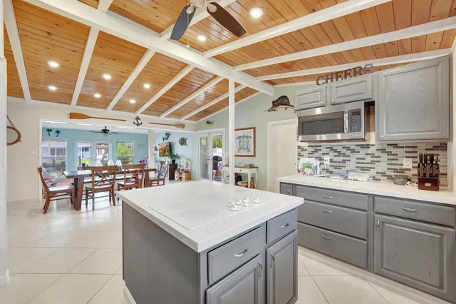 a kitchen with a sink cabinets and appliances