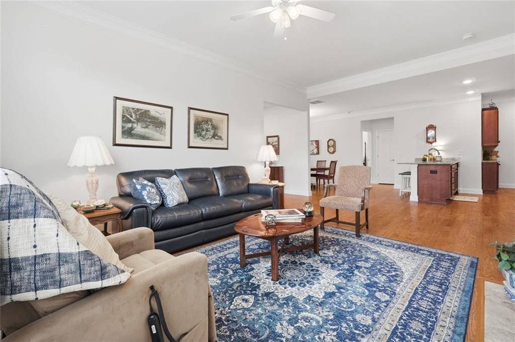 3328 Ivy Ridge Court Buford, GA 30519 - Photo 15 of 34 a living room with furniture and a wooden floor
