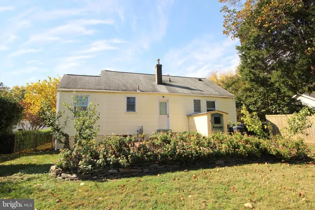 a view of a yard with large trees