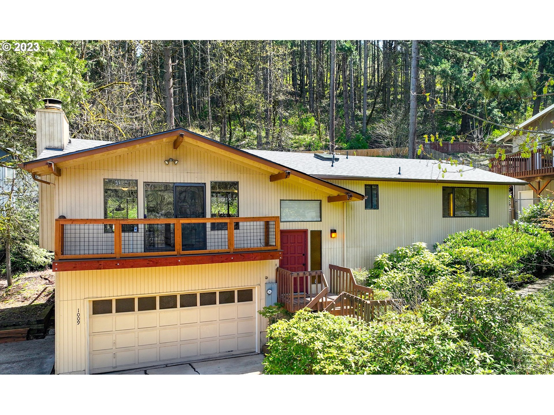 1009 South 70th Street Springfield, OR 97478 - Photo 1 of 48 a view of a house with a swimming pool