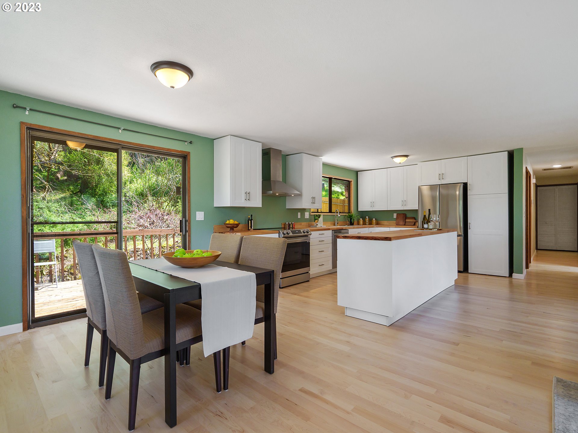 1009 South 70th Street Springfield, OR 97478 - Photo 12 of 48 a view of a dining room with furniture and wooden floor