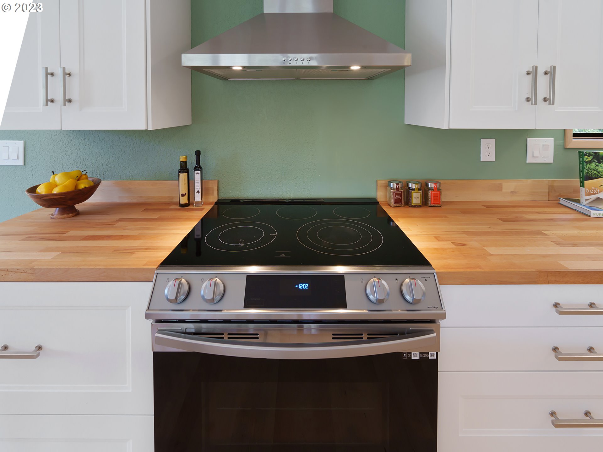 1009 South 70th Street Springfield, OR 97478 - Photo 14 of 48 a kitchen with a stove and cabinets