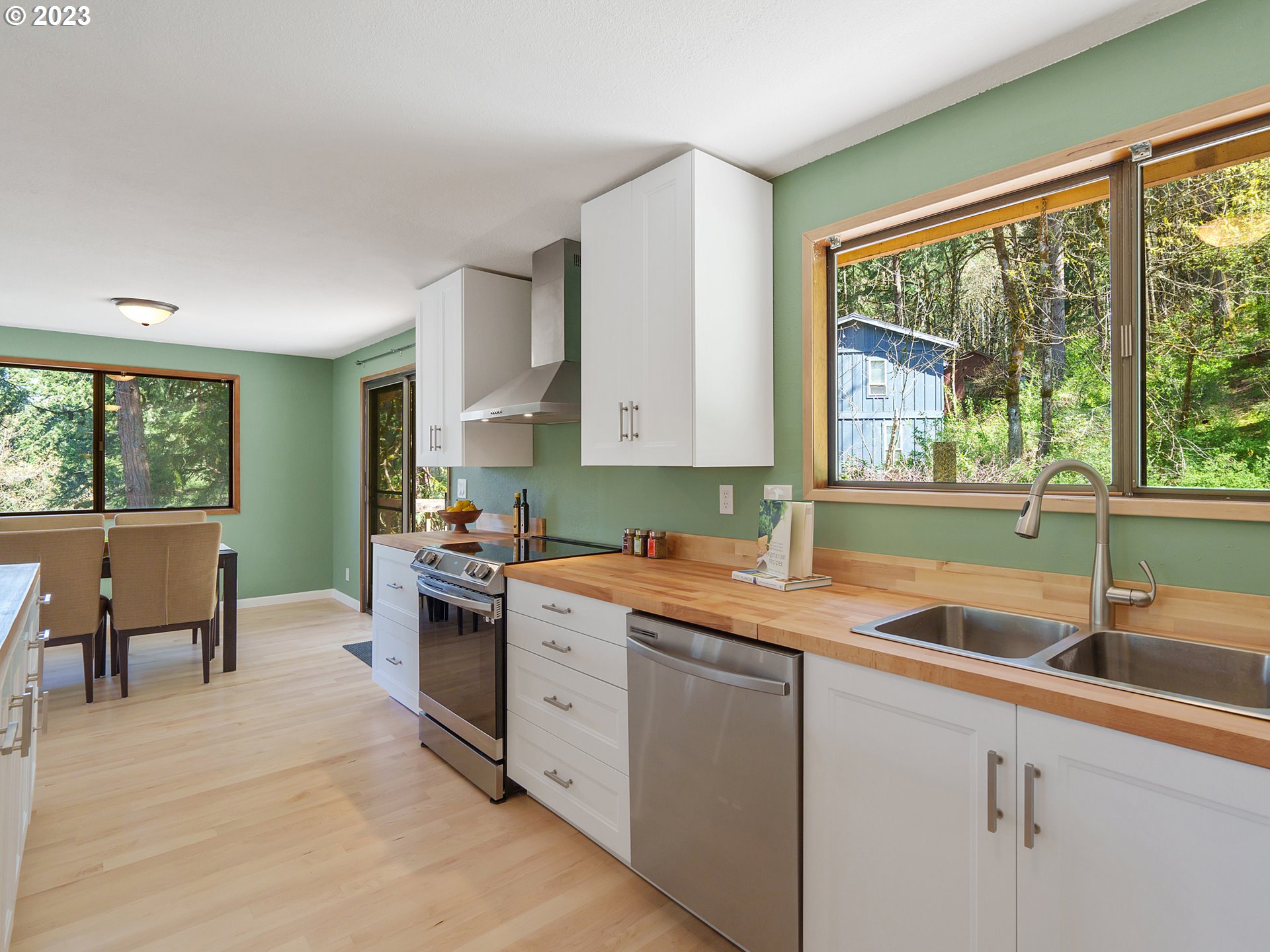 1009 South 70th Street Springfield, OR 97478 - Photo 17 of 48 a kitchen that has a sink and a stove in it