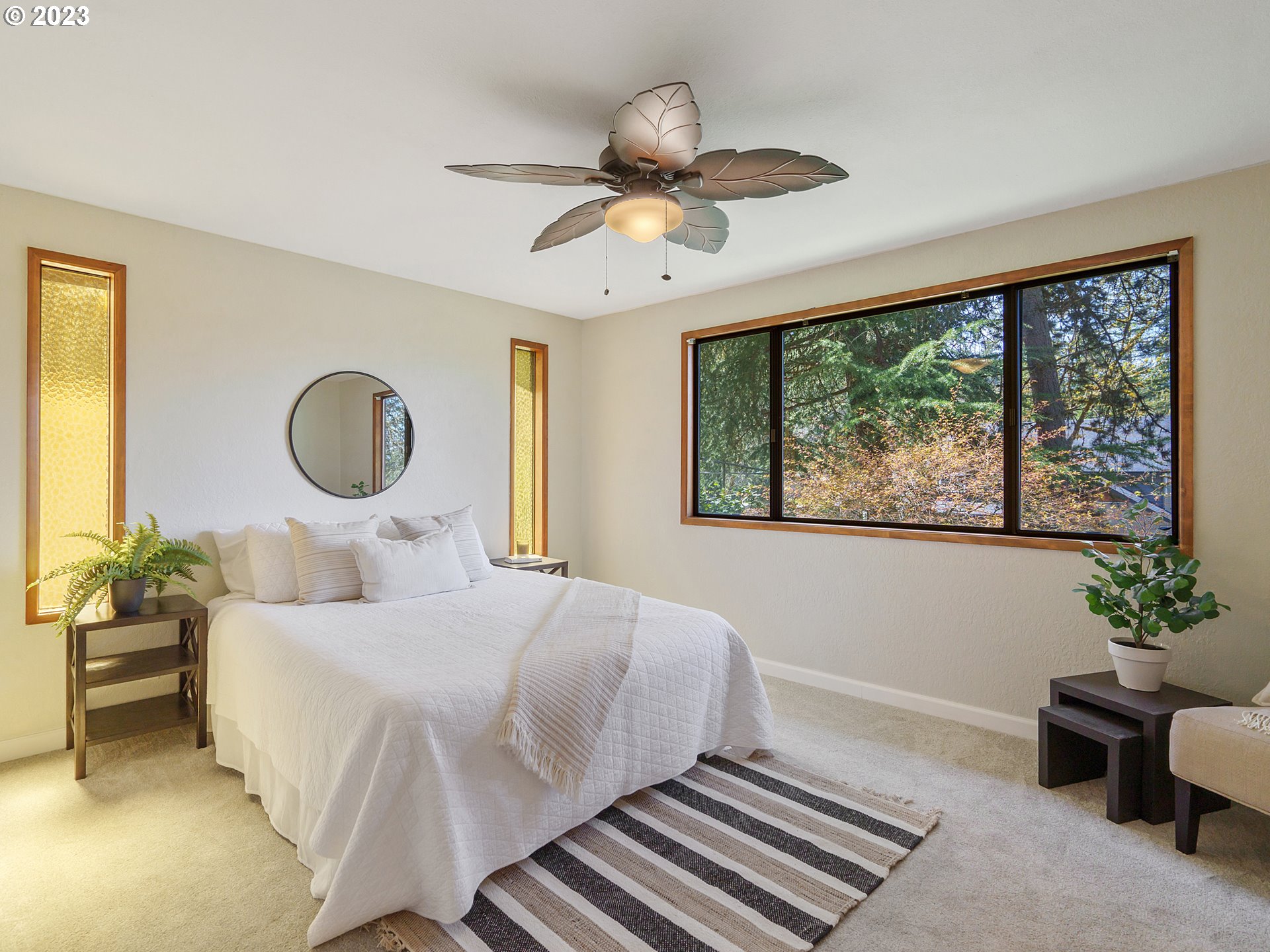 1009 South 70th Street Springfield, OR 97478 - Photo 27 of 48 a bedroom with a bed and a chandelier
