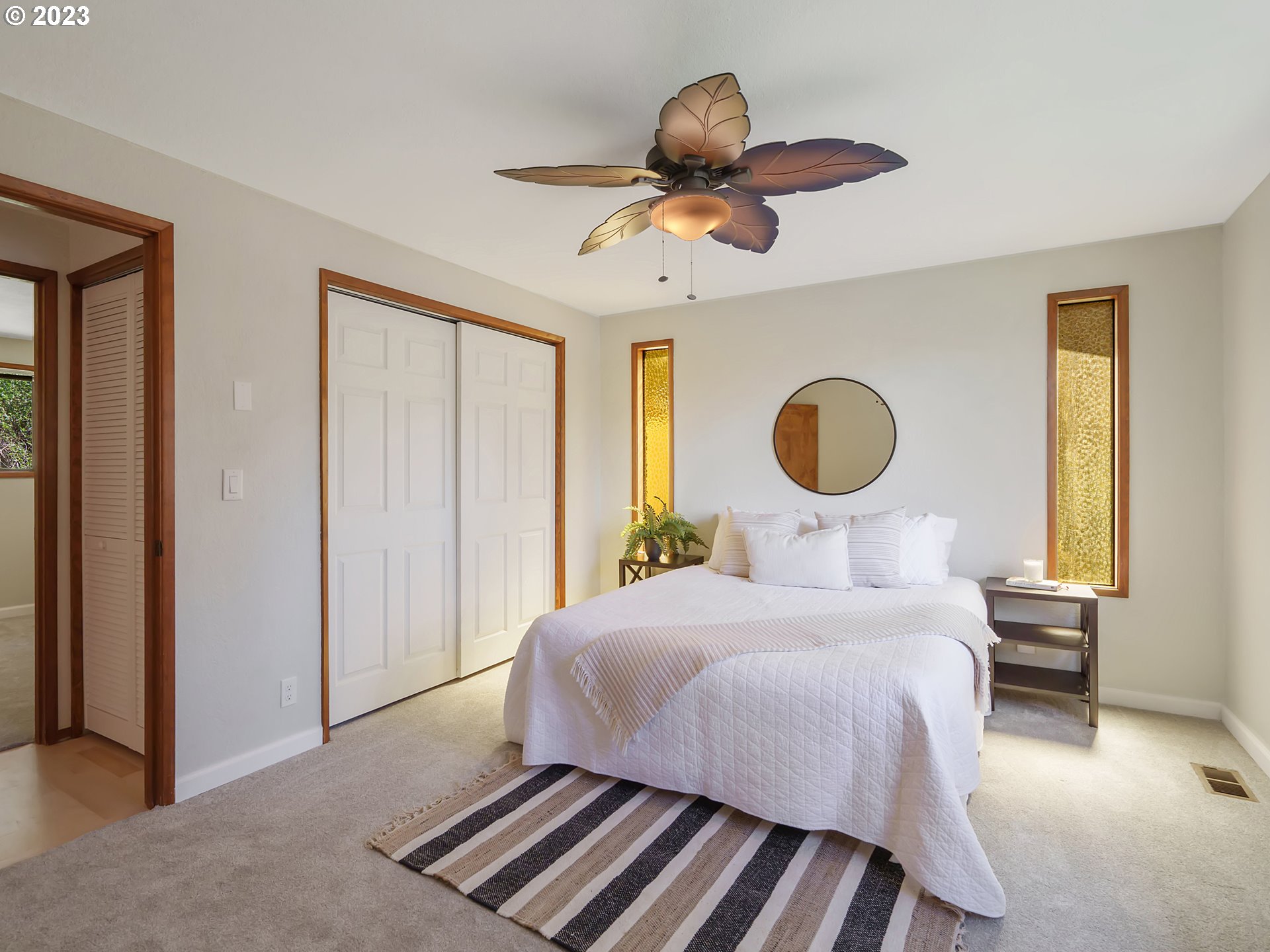 1009 South 70th Street Springfield, OR 97478 - Photo 28 of 48 a bedroom with a bed and a chandelier
