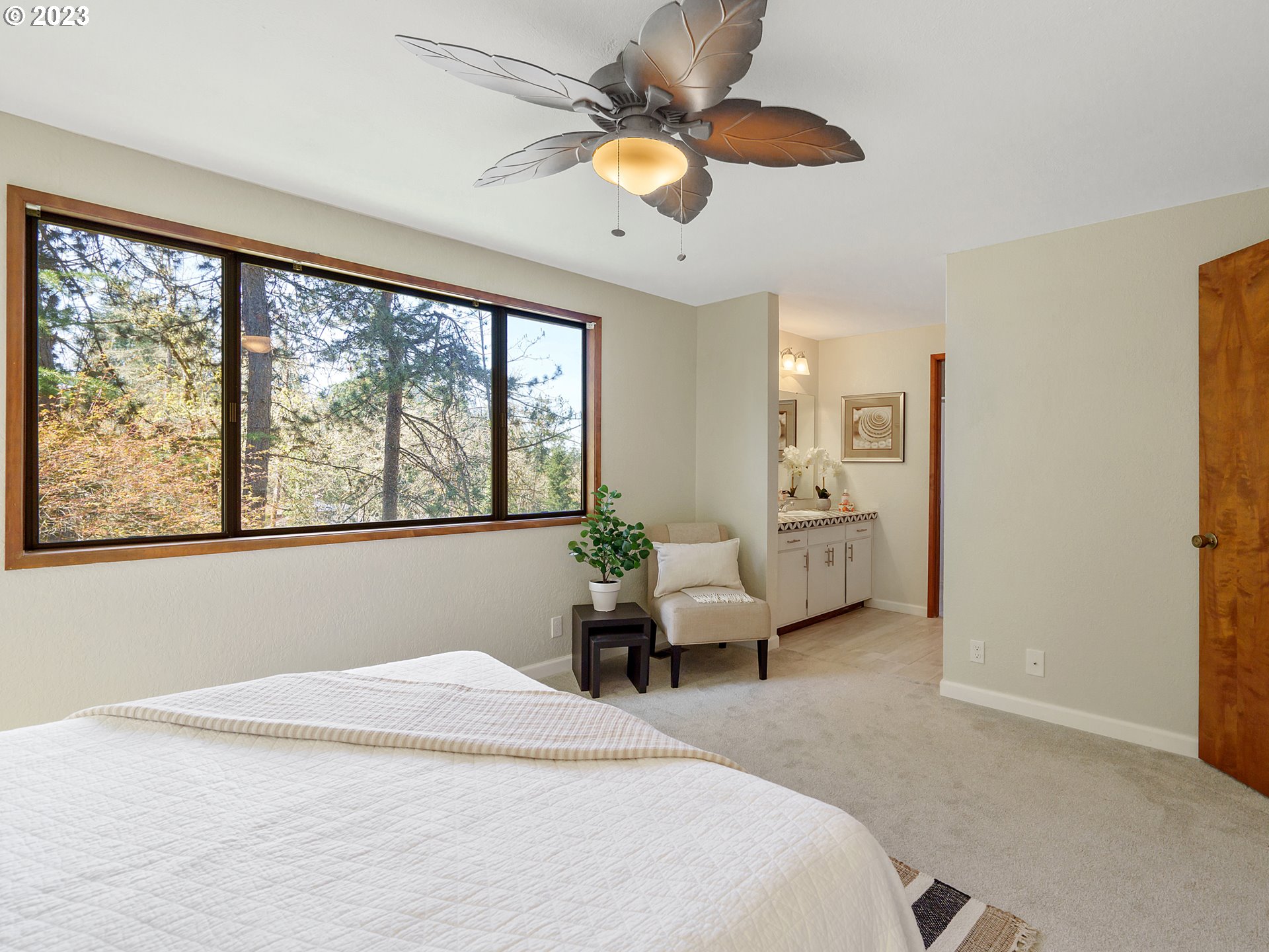 1009 South 70th Street Springfield, OR 97478 - Photo 30 of 48 a bedroom with a large bed and a large window