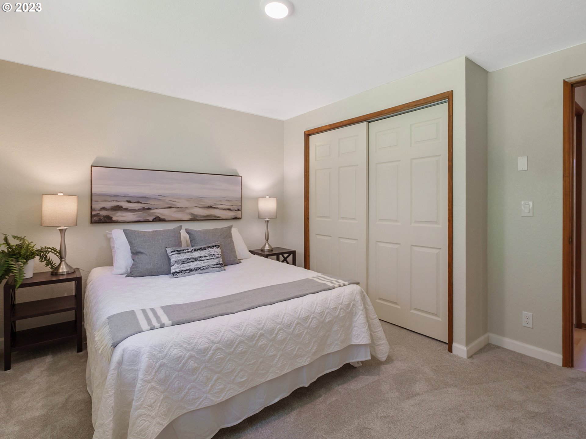 1009 South 70th Street Springfield, OR 97478 - Photo 37 of 48 a bedroom with a bed and a lamp