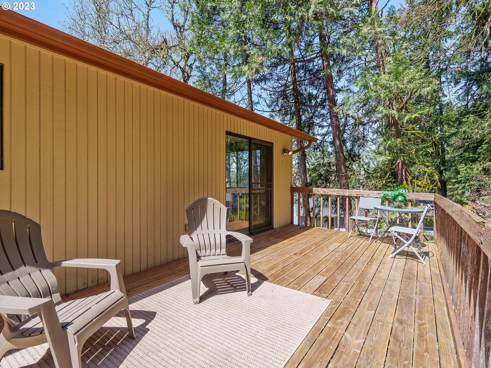 1009 South 70th Street Springfield, OR 97478 - Photo 42 of 48 a balcony with wooden floor outdoor seating and yard in the back