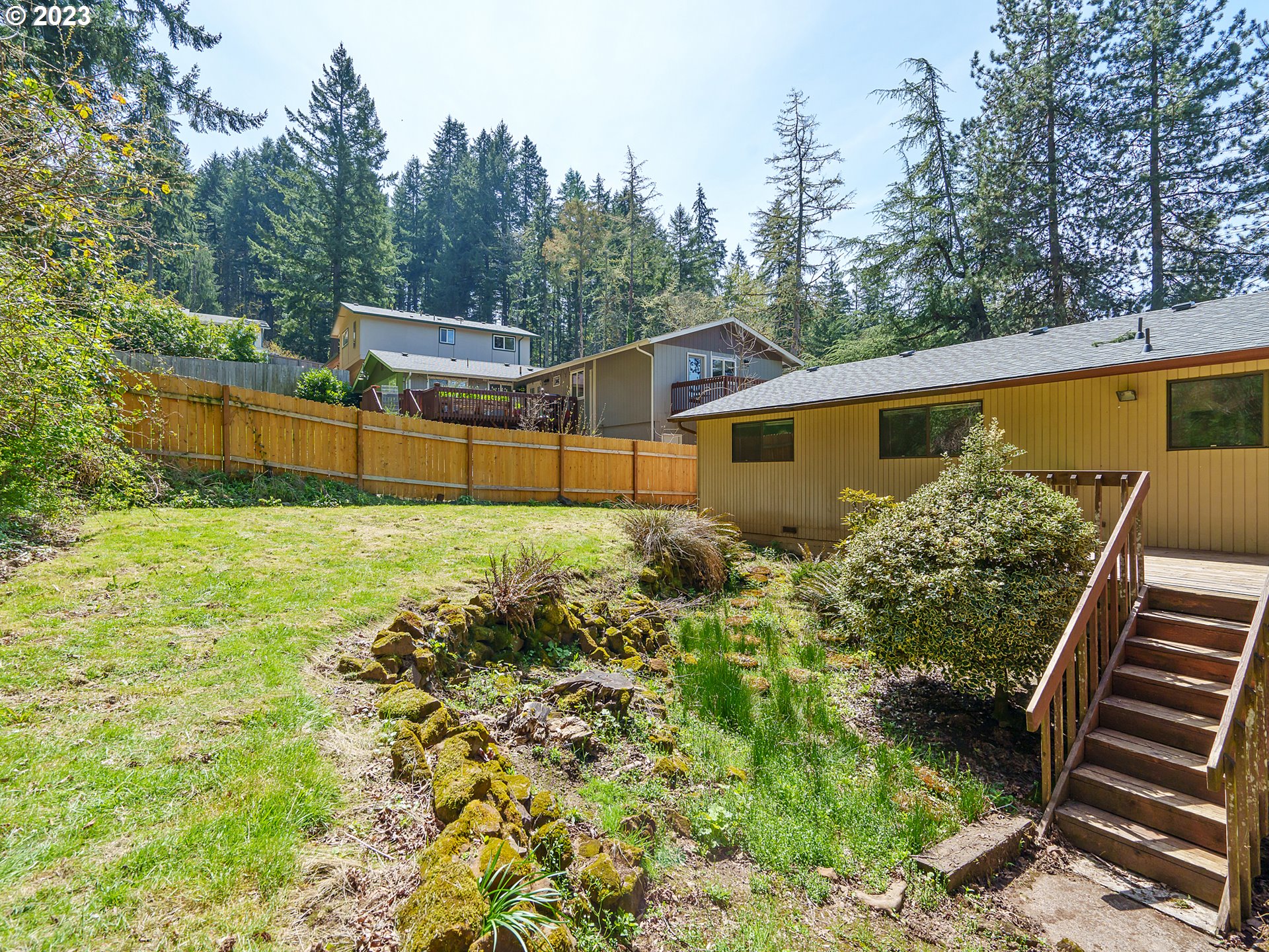 1009 South 70th Street Springfield, OR 97478 - Photo 45 of 48 a side view of a house with garden