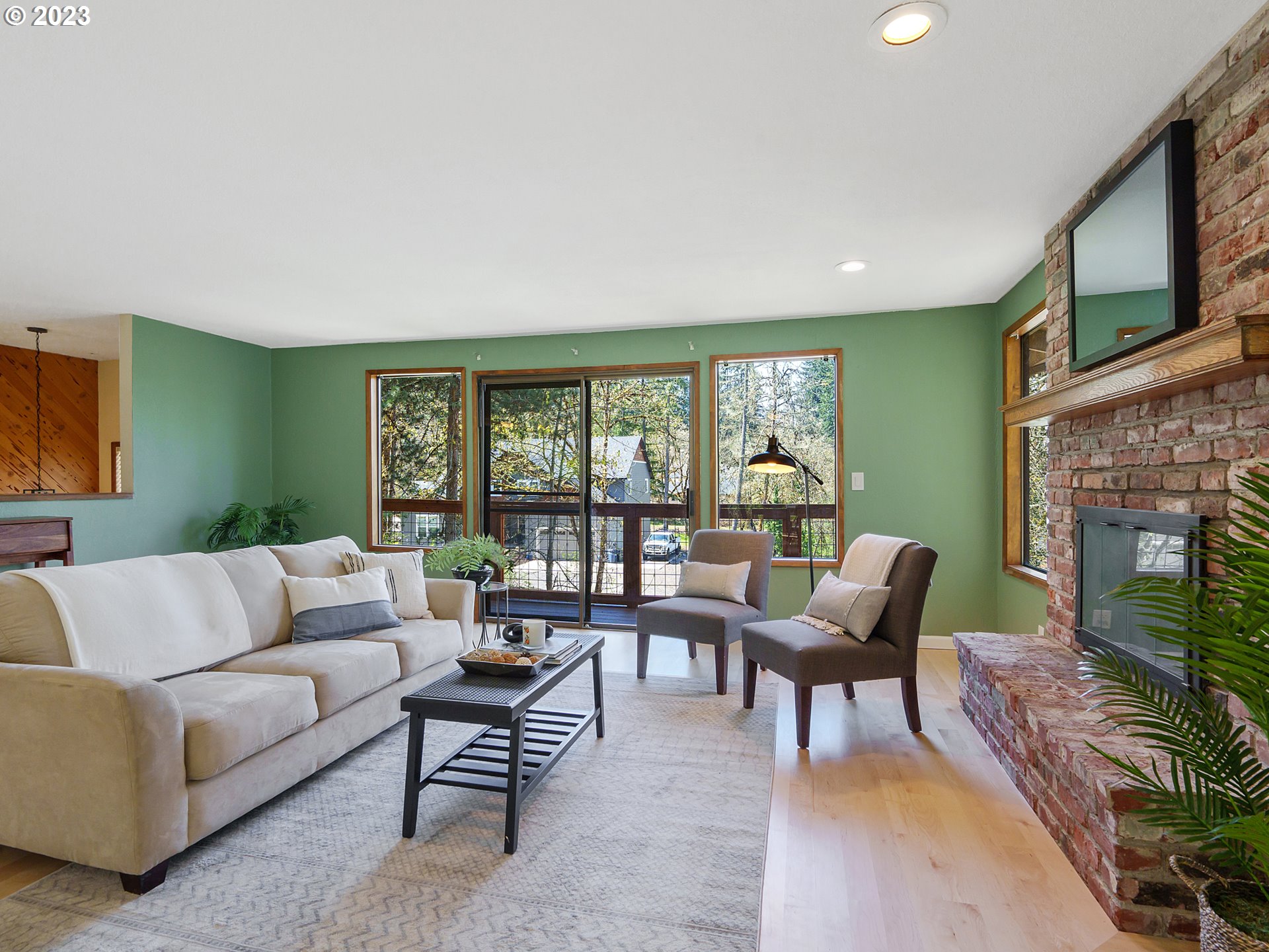 1009 South 70th Street Springfield, OR 97478 - Photo 9 of 48 a living room with furniture and a fireplace