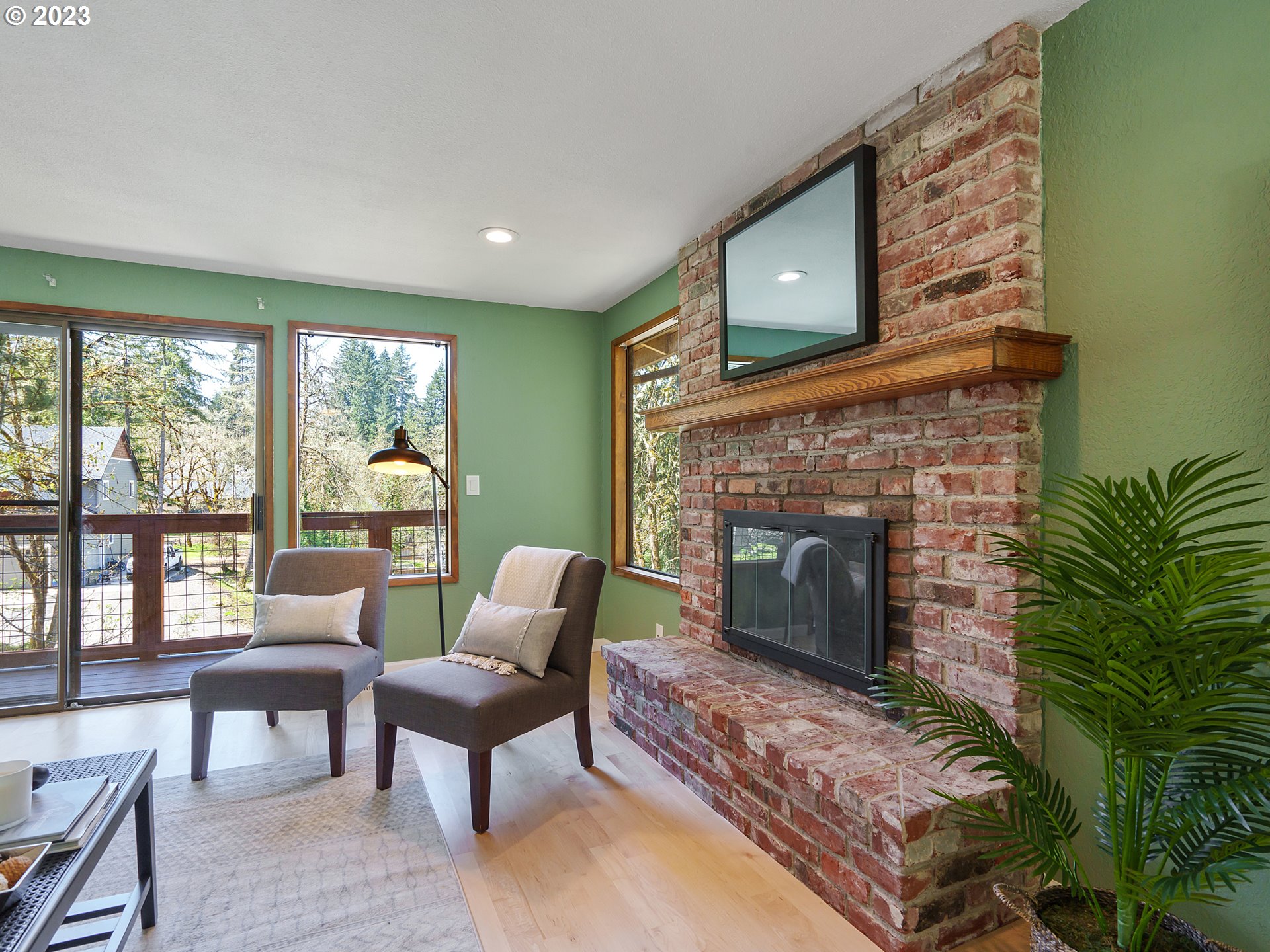 1009 South 70th Street Springfield, OR 97478 - Photo 10 of 48 a living room with furniture and a fireplace