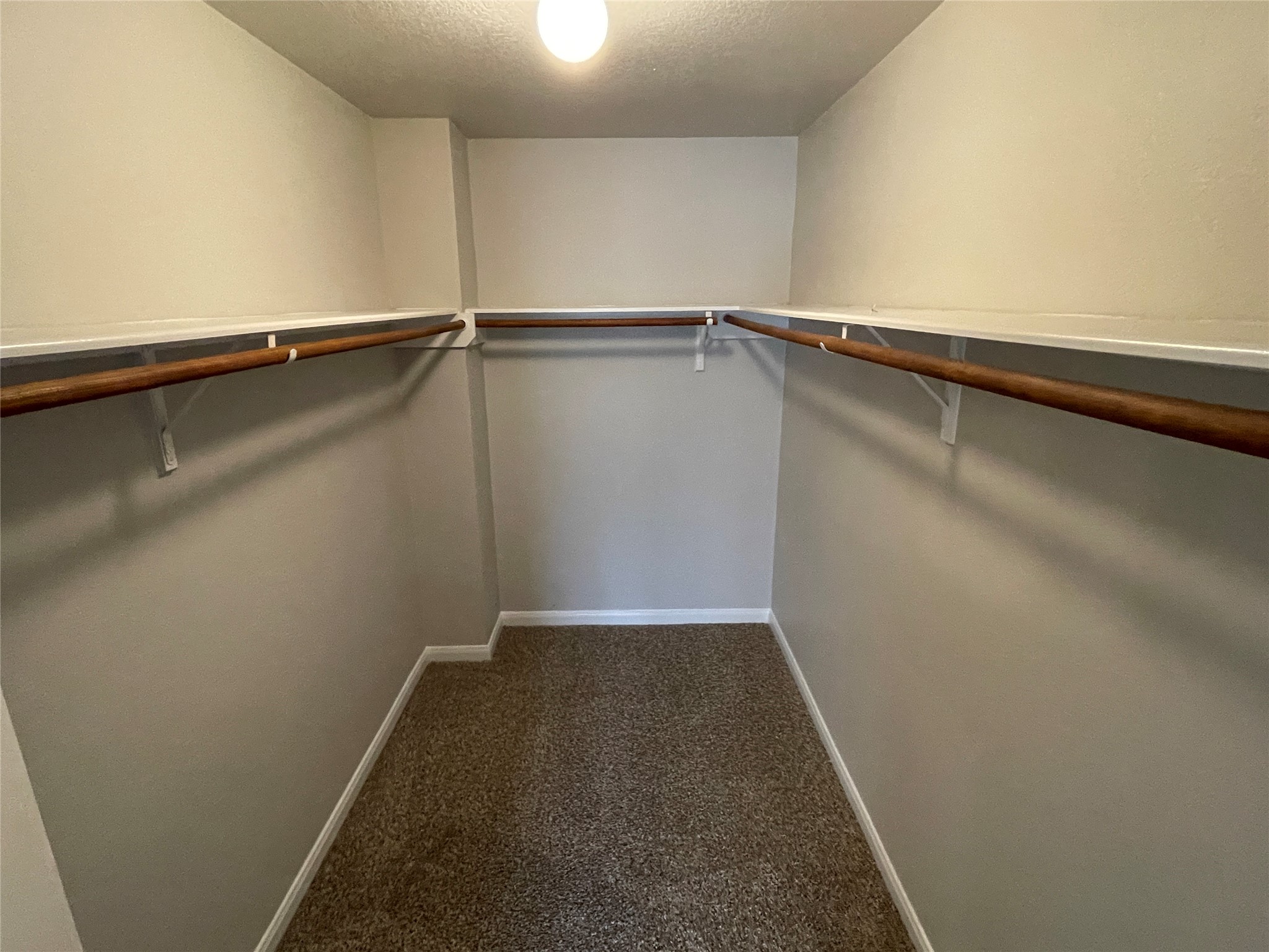 18207 Ridge Stream Lane Cypress, TX 77429 - Photo 13 of 18 Walk in closet for the primary bedroom