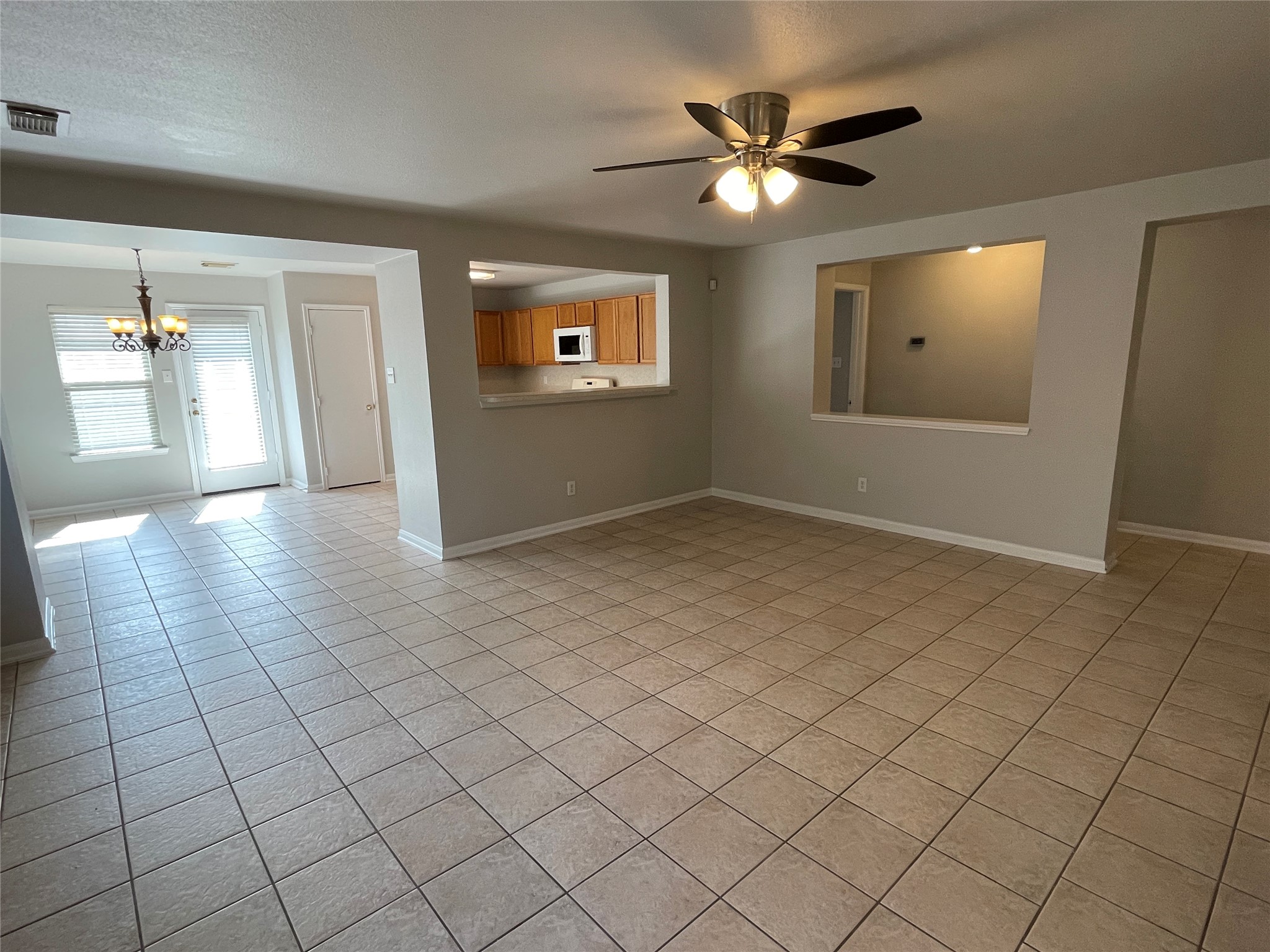 18207 Ridge Stream Lane Cypress, TX 77429 - Photo 18 of 18 Open floor plan with recent paint and tiled floors