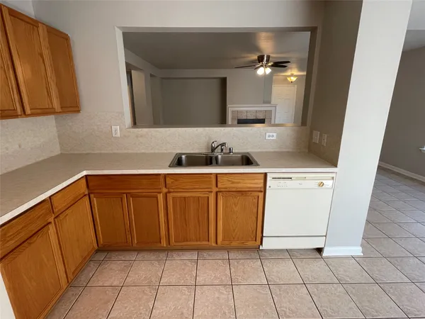a view of an empty room and a window