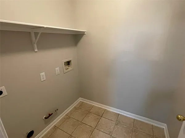 a kitchen with a stove a refrigerator and a sink